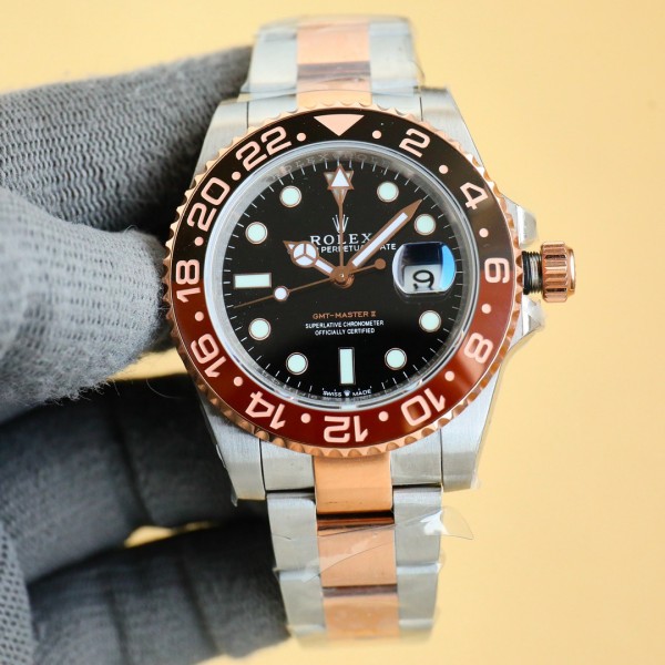 Rolex GMT-Master series, black dial, black and red bezel, 40mm, gold and silver Oyster bracelet.